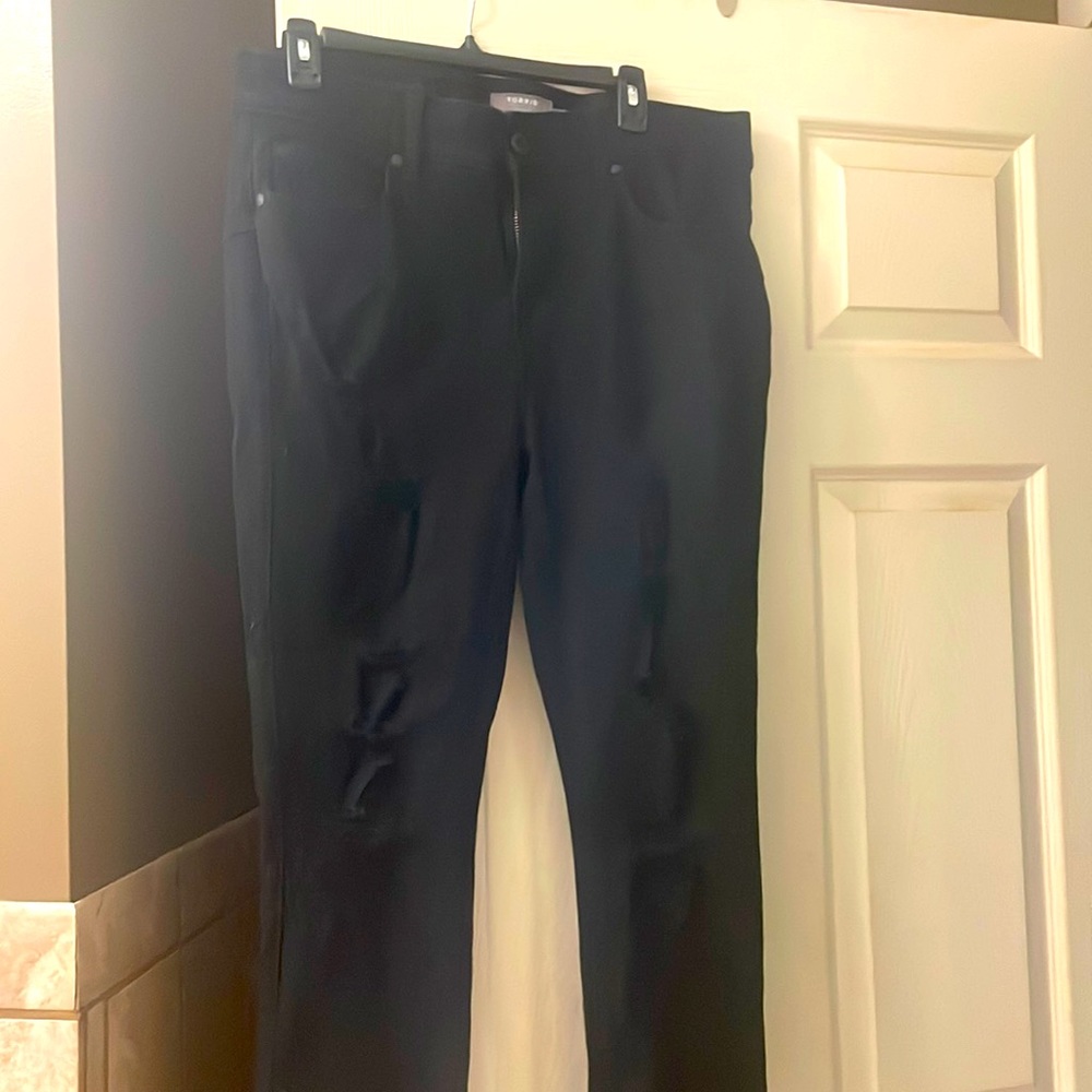 Torrid black jeans, bombshell skinny, rips in front